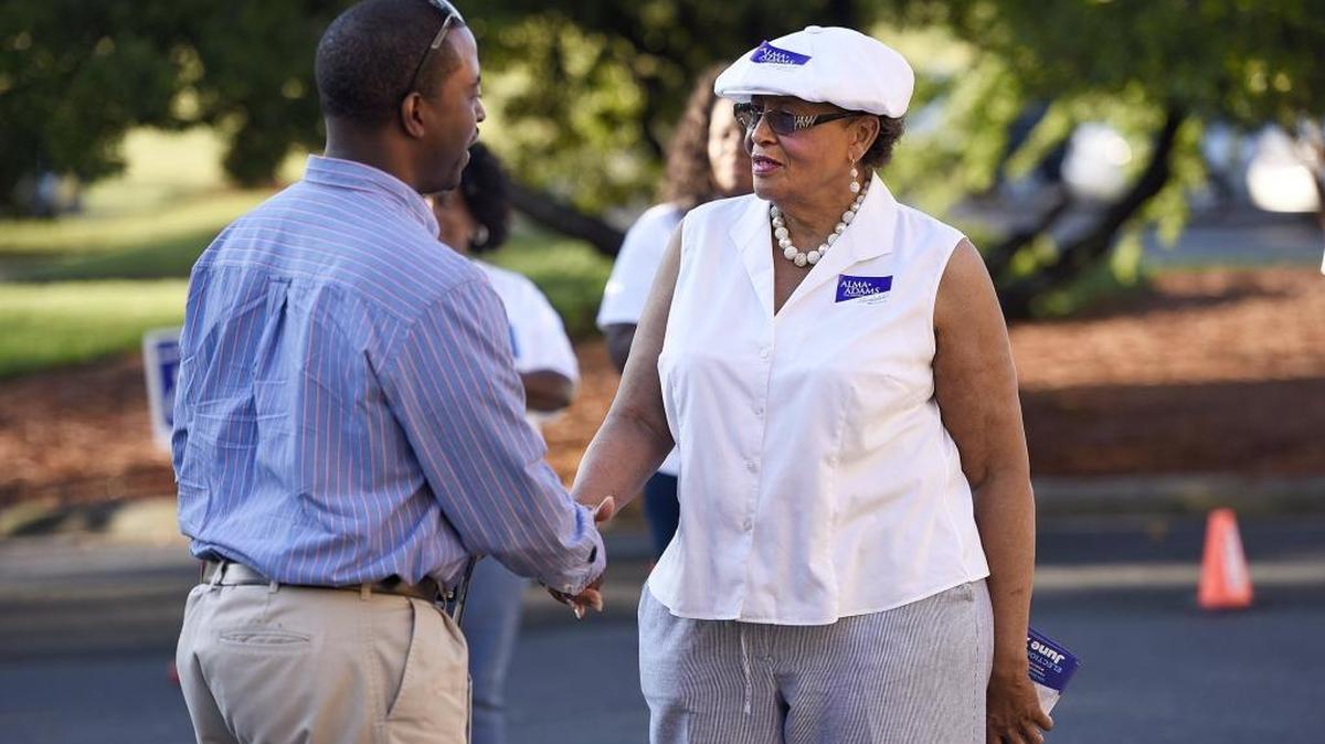 U.S. Rep. Alma Adams greets voters Tuesday. She won easily in a newly drawn 12th District.