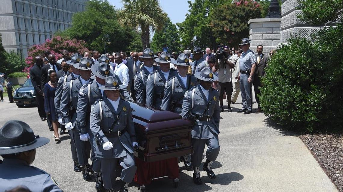 A Highway Patrol honor guard carries Sen. Clementa Pinckney’s casket in 2015. Pinckney was killed by Dylann Roof.