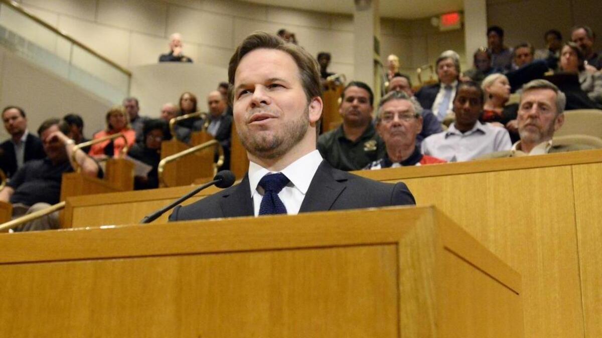 Marcus Smith, CEO of Speedway Motorsports, speaks to the Mecklenburg County Board of Commissioners during a January hearing on a soccer stadium proposal.