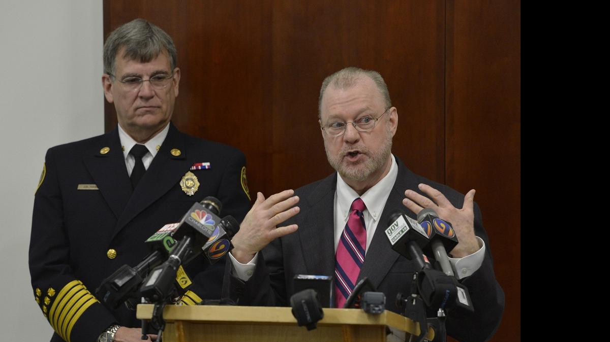 
City Manager Ron Carlee and Fire Chief Jon Hannan speak at a press conference Tuesday.

