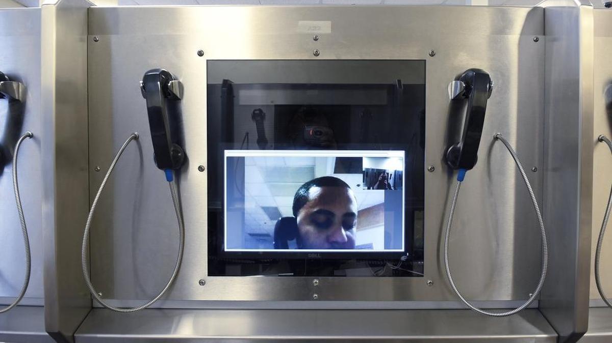 A Mecklenburg County Sheriff's Department deputy demonstrates in October how video visitation works.