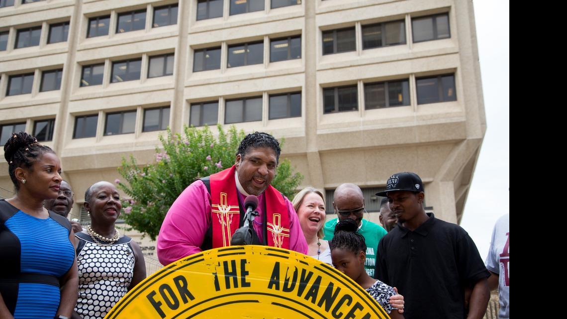 
N.C. NAACP President William Barber II speaks outside court.
