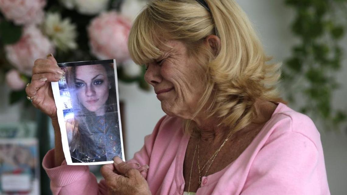 Michelle Holley holds a photo of her daughter Jaime Holley, 19, who died of a heroin overdose last year.