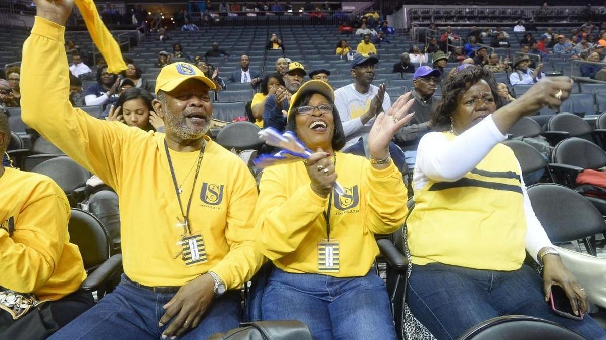 Tommie Dewalt (left), Hattie Dewalt and Dorothy Davis cheer during the CIAA tournament.