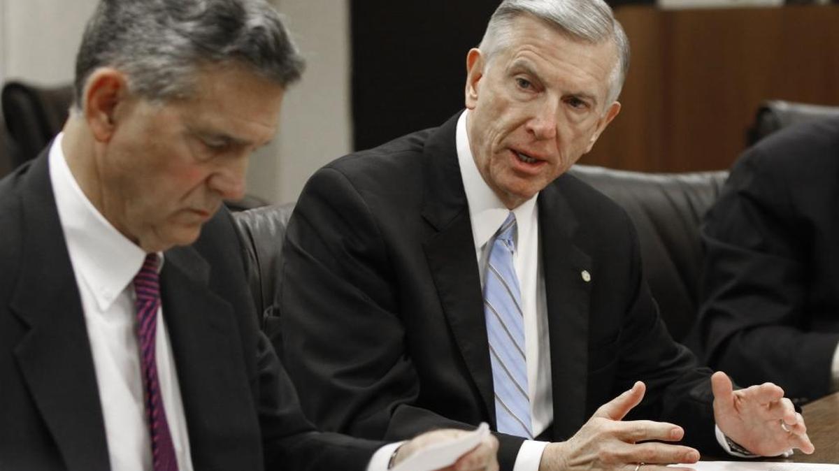 
Tom Ross, right, sits with UNC chair John Fennebresque in January.
