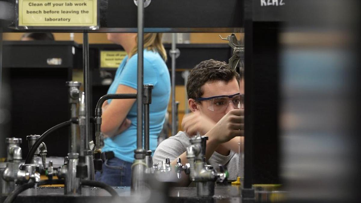Student Callum Montgomery works in an outdated chemistry lab at UNC Charlotte.