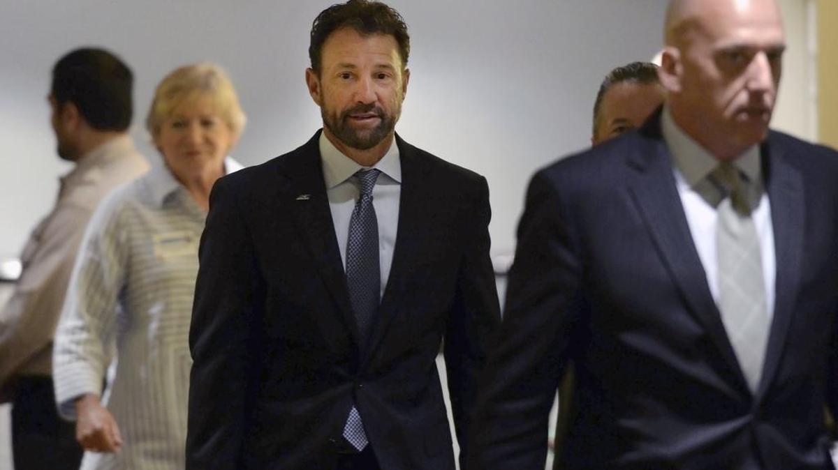 North Carolina football coach Larry Fedora, center, arrives at an NCAA hearing in August in Nashville.