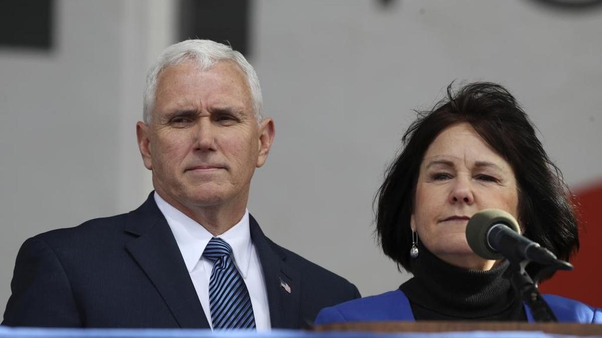 Vice President Mike Pence says he won’t be alone with a woman other than his wife, Karen (right).