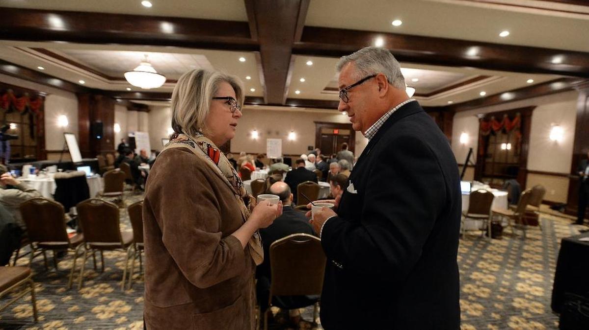 Henry Hinton talks with UNC President Margaret Spellings last year.