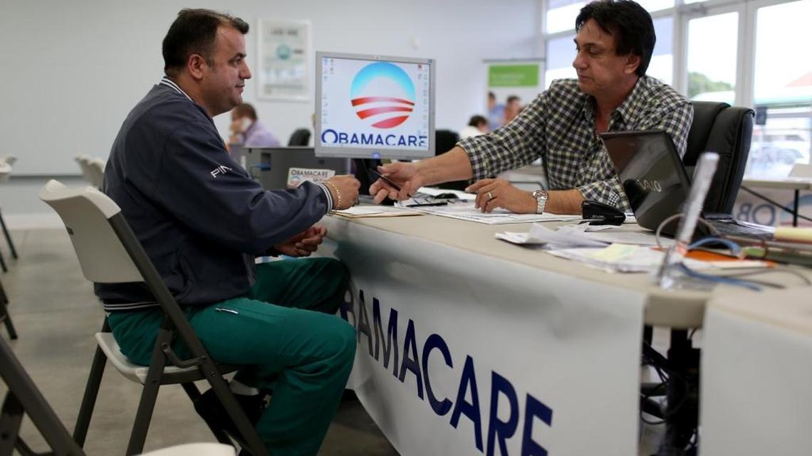 Signing up for Obamacare in Miami. The health care plan continues to meet enrollment projections.