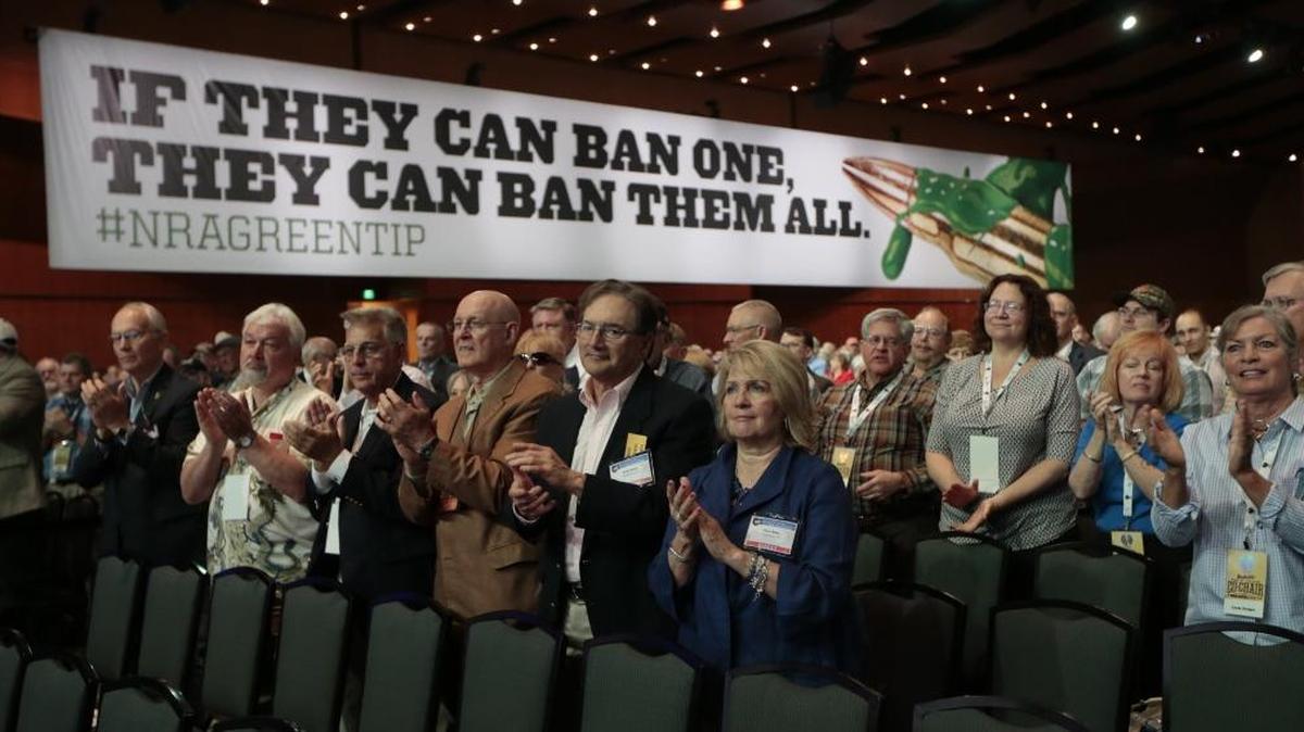 People applaud a speaker at the National Rifle Association convention in Nashville, Tenn., in 2015.