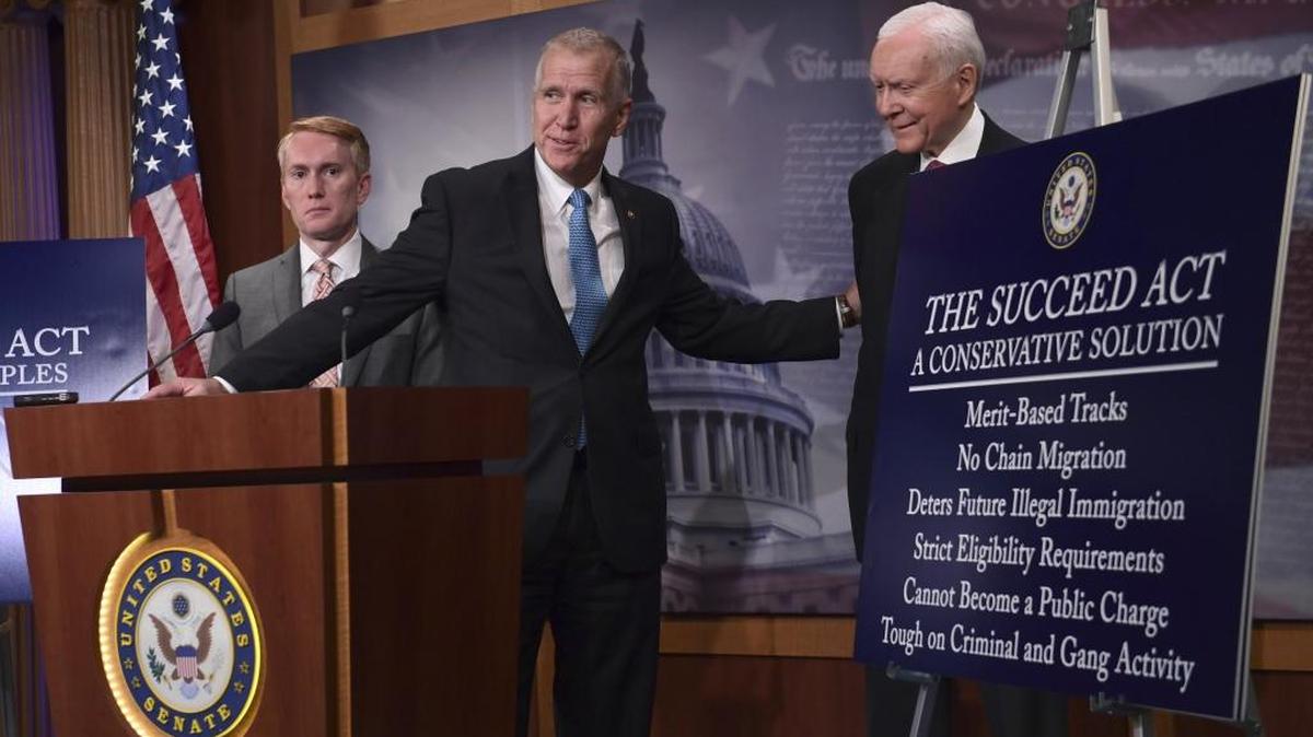 Sen. Thom Tillis, with Sen. James Lankford, R-Okla., left, and Sen. Orrin Hatch, R-Utah, talk about the Succeed Act last month.