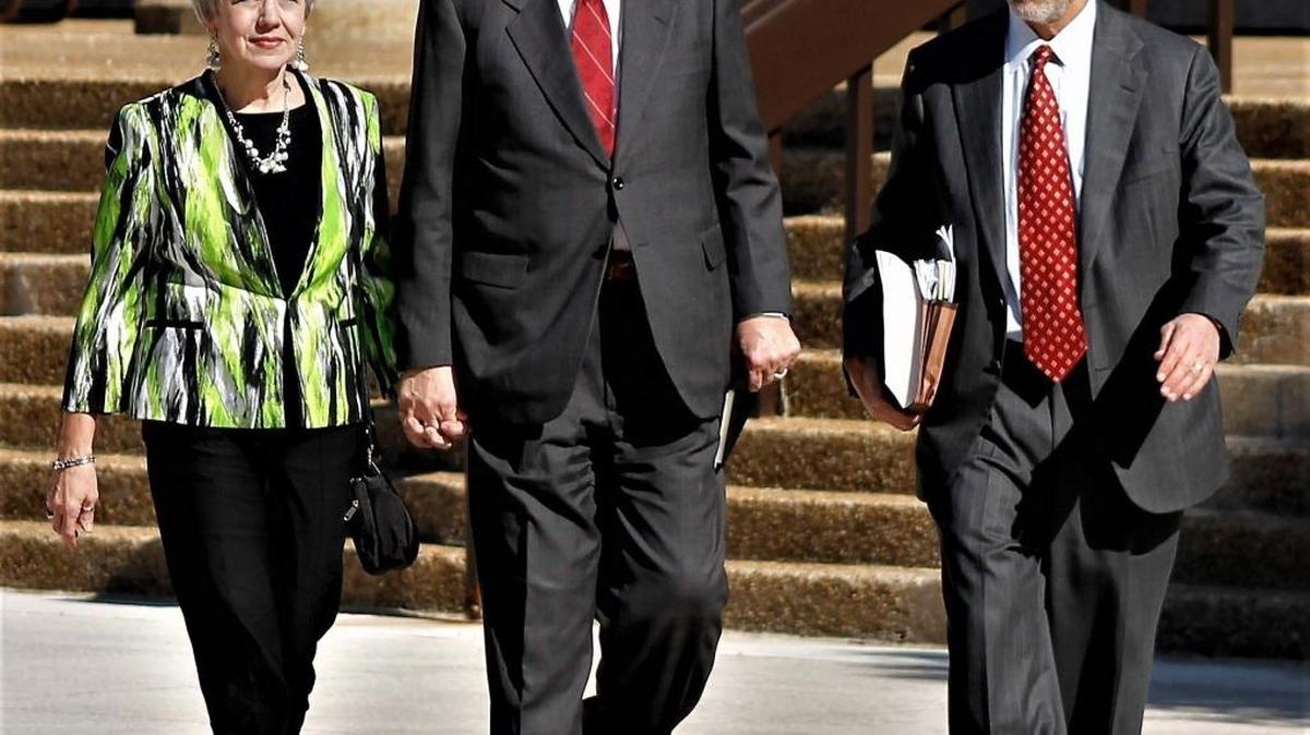 Former North Carolina state Sen. Fletcher Hartsell, flanked by his wife, Tana, and defense attorney Rock Glaser, are shown leaving the federal courthouse on Tuesday.