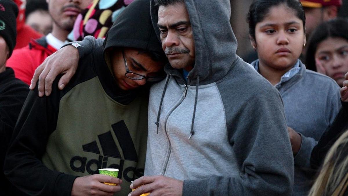 Family and friends listen to others speak about Josue Javier Diaz the day after he was shot by an undercover detective.