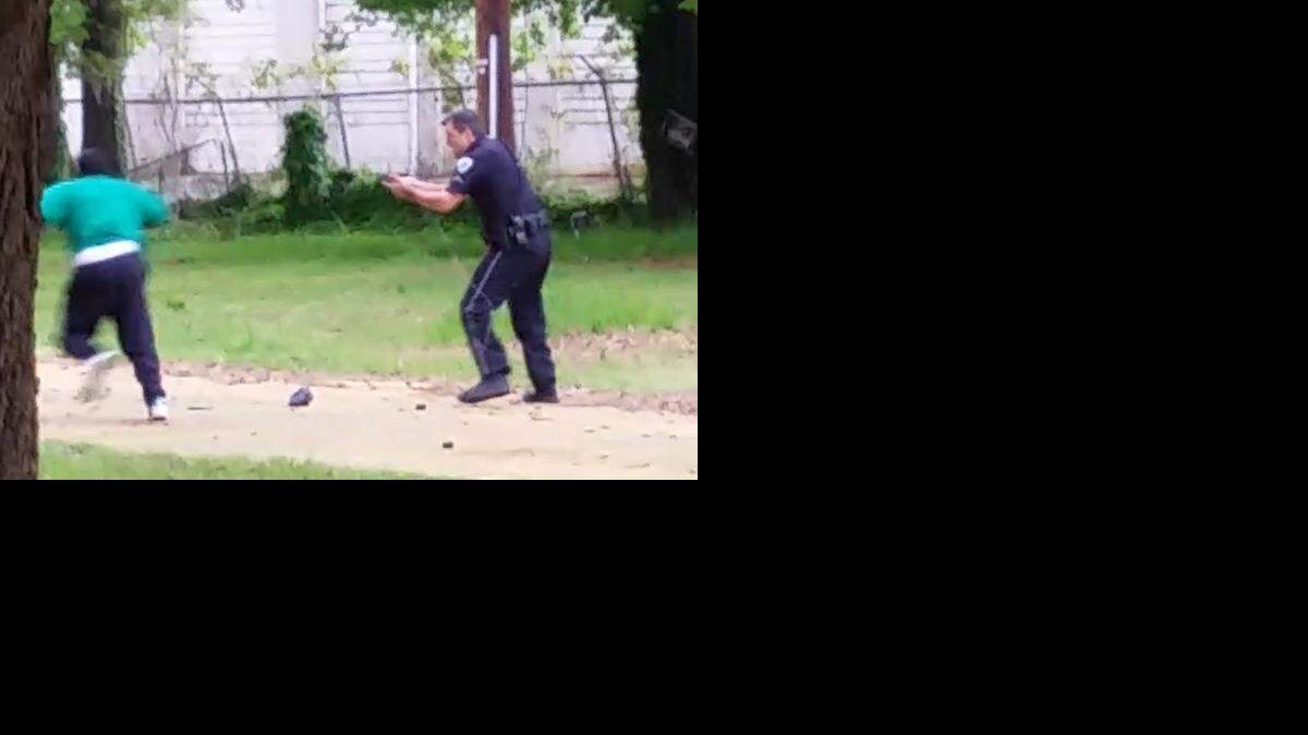 
This video still shows the men just before the shooting began.
