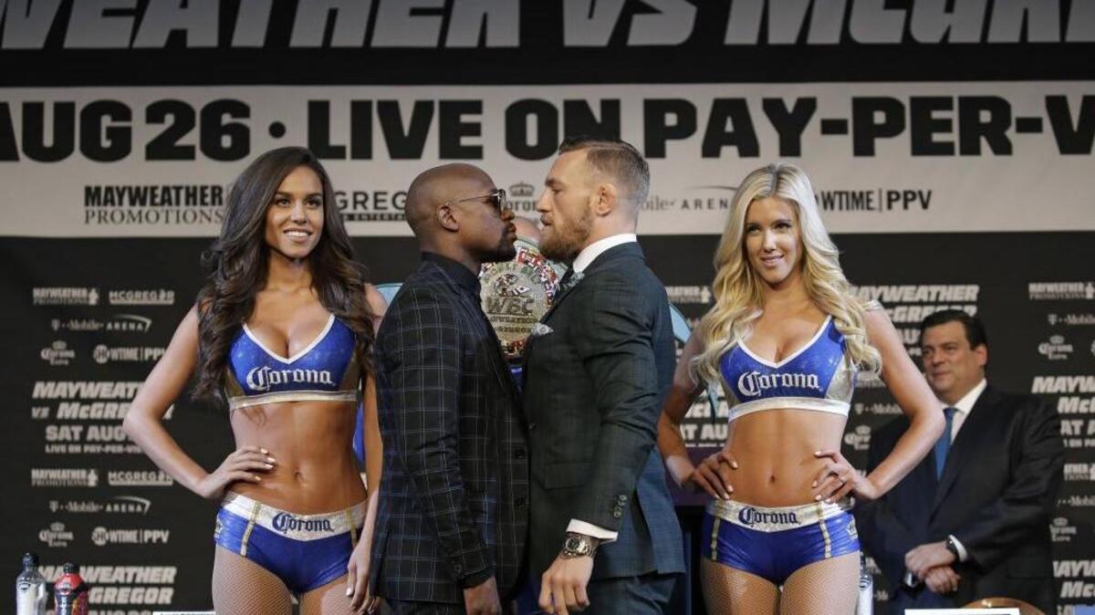 Floyd Mayweather Jr., and Conor McGregor during a news conference Wednesday in Las Vegas.