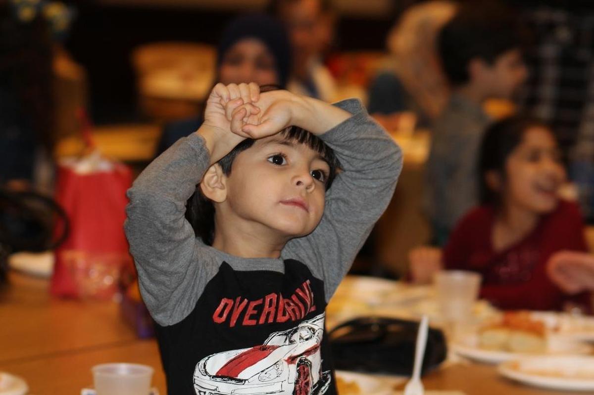 This boy from Syria loves fire trucks.