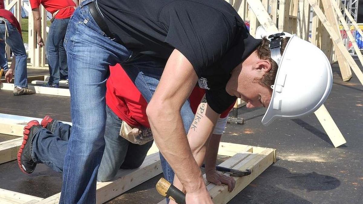 NASCAR Sprint Cup Series driver Kasey Kahne helped build a low-cost Habitat for Humanity house in this 2014 photo.
