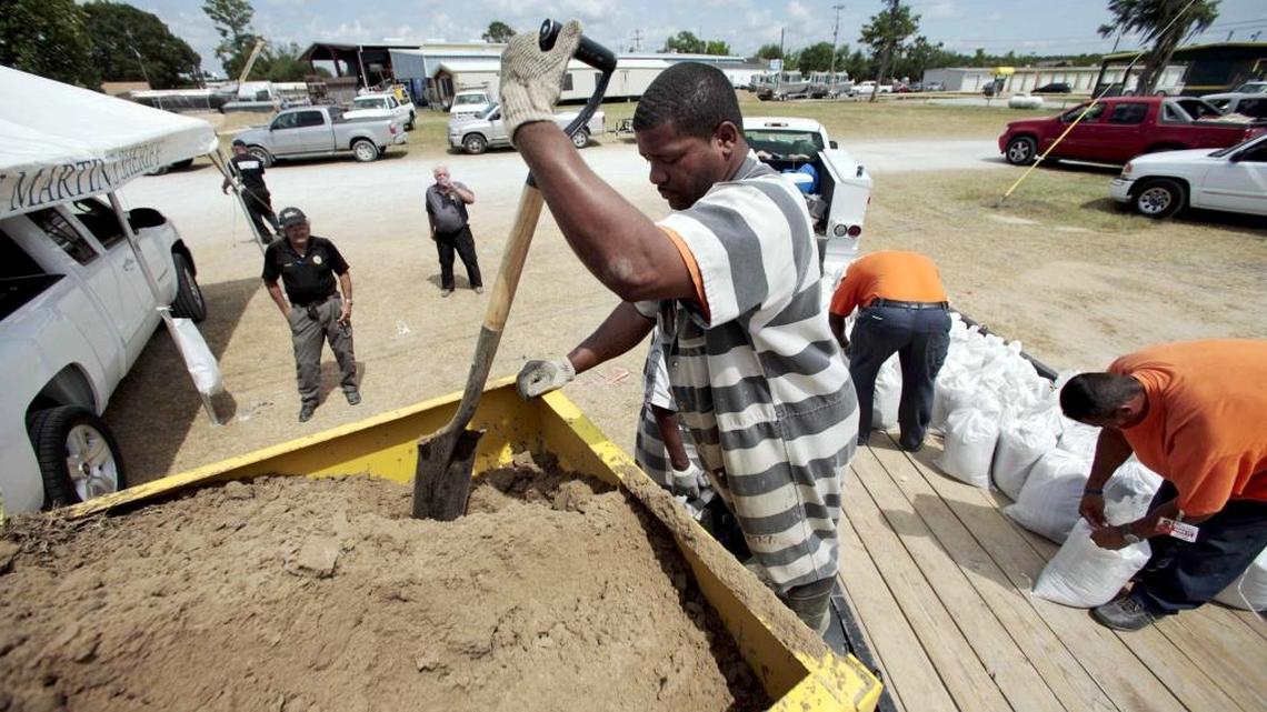 An inmate trustee makes sand bags in Stephensville, La., in anticipation of a flood in 2011.