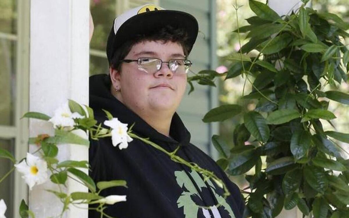 Gavin Grimm on his front porch during a 2015 interview at his home in Gloucester, Va. A U.S. appeals court has overturned a policy barring a transgender student from using the boys’ restrooms at his Virginia high school. A federal appeals court won't reconsider a three-judge panel's ruling that the transgender teen must be allowed to use the boys' restroom at school.