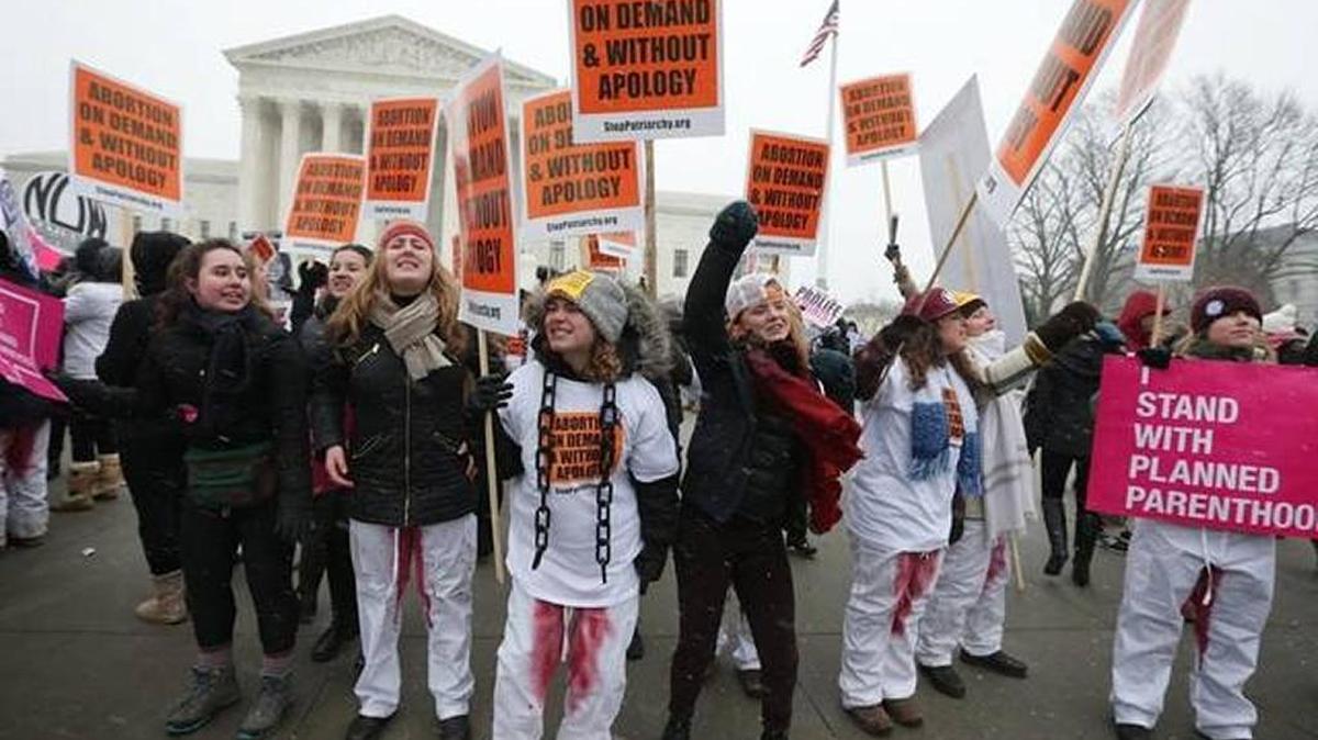 Pro-choice activists participate in a ‘Rise Up for Roe’ rally outside the U.S. Supreme Court during the 2016 March for Life event in Washington, DC. The annual March for Life event marked the anniversary of the Supreme Court Roe v. Wade ruling in 1973.