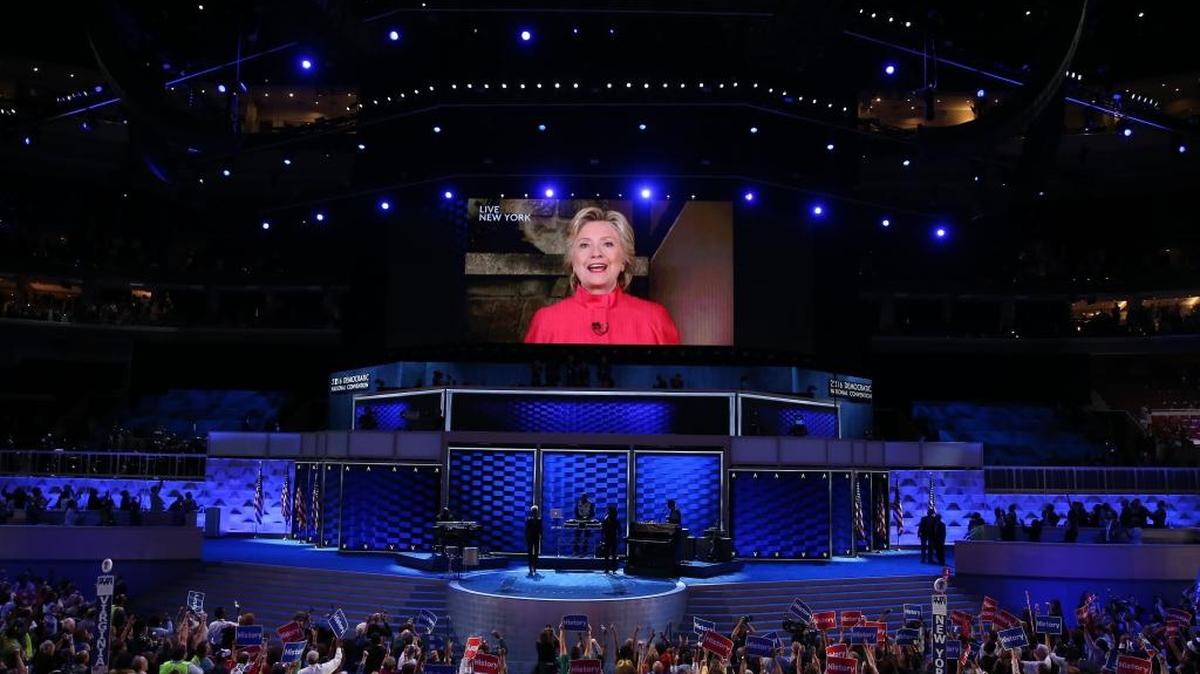 Hillary Clinton speaks on screen Tuesday during the Democratic National Convention in Philadelphia.