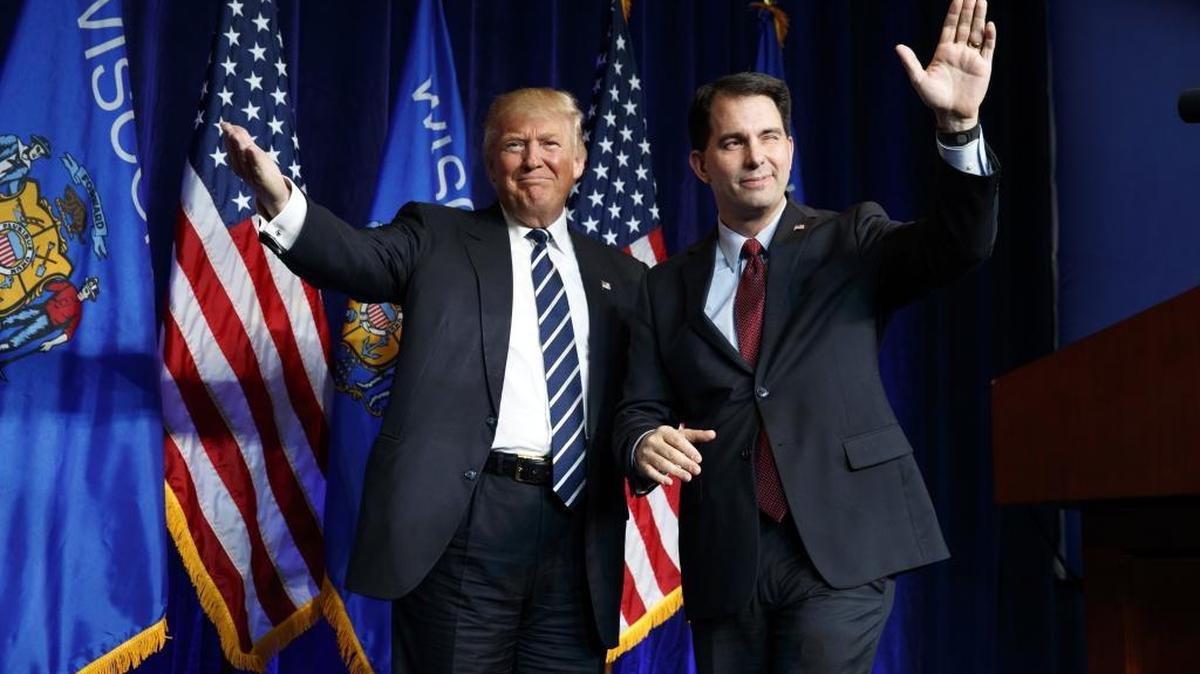 Better days for the GOP: Gov. Scott Walker, R-Wis., right, winks as he walks offstage after introducing Republican presidential candidate Donald Trump during a campaign rally at the University of Wisconsin Eau Claire last November.
