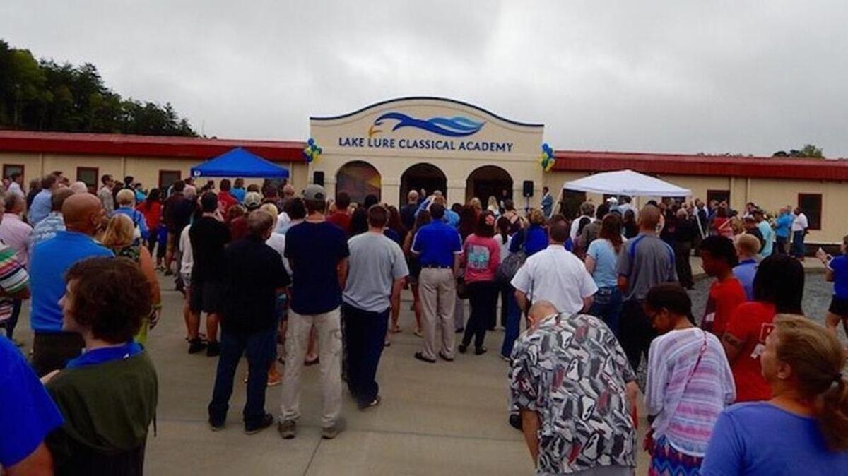 A ribbon-cutting ceremony in August for Lake Lure Classical Academy’s new home in Rutherford County.