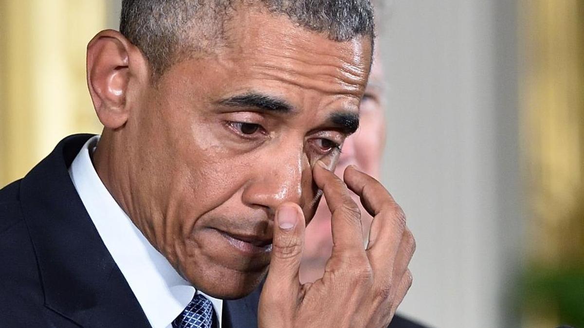 President Obama wipes a tear Tuesday at the White House as he speaks on reducing gun violence.