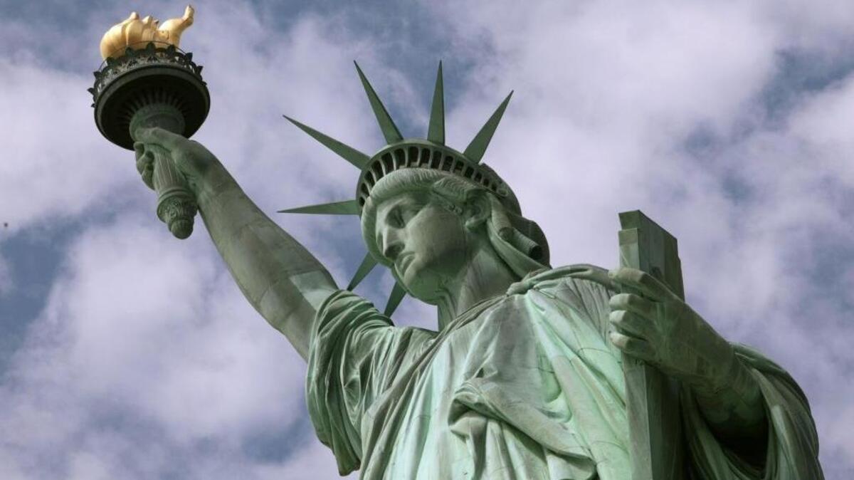 Thanks to the brave soldiers who fought on D-Day long ago, “Miss Liberty” stands brave and tall, welcoming all.