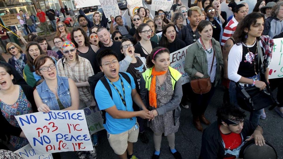 Protesters chant in Chapel Hill on Tuesday to protest HB 2.