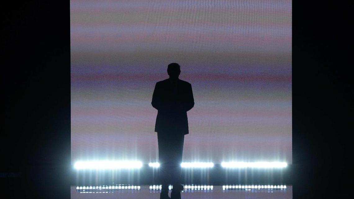 Donald Trump arrives on stage on the first day of the Republican National Convention.