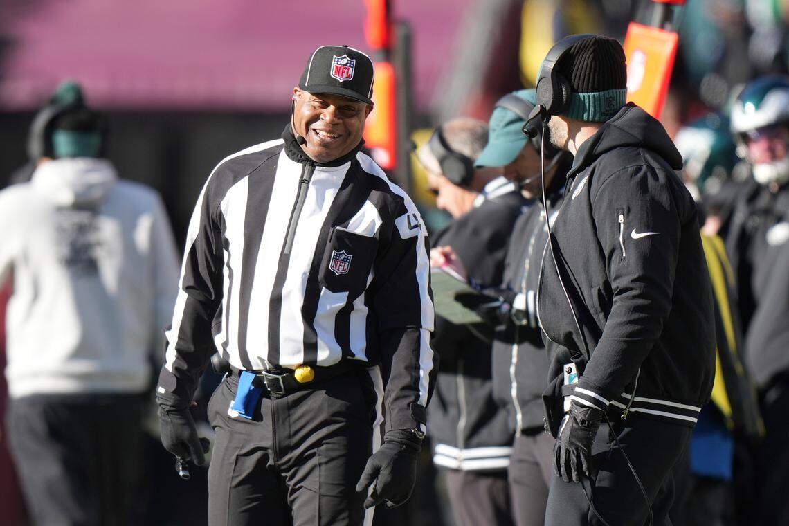 Side judge Boris Cheek (41) stars a laugh with Philadelphia Eagles head coach Nick Sirianni during an NFL football game against the Washington Commanders, Sunday, Dec. 22, 2024, in Landover, MD. (AP Photo/Peter Joneleit)