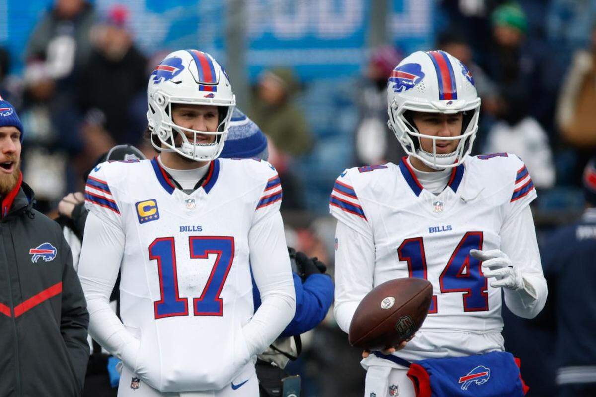Josh Allen of the Buffalo Bills and then-teammate Mike White warm up before a game against the New England Patriots on Jan. 5, 2025 in Foxborough, Massachusetts. 