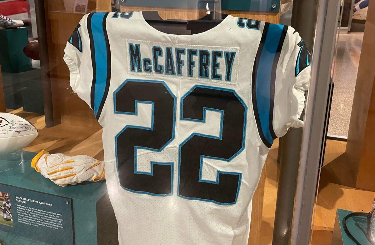 A Christian McCaffrey jersey is the main piece of an exhibit dedicated to one of the greatest Carolina Panthers running backs in team history.