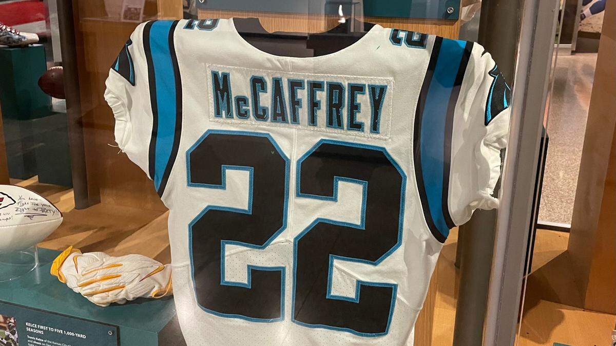A Christian McCaffrey jersey is the main piece of an exhibit dedicated to one of the greatest Carolina Panthers running backs in team history.