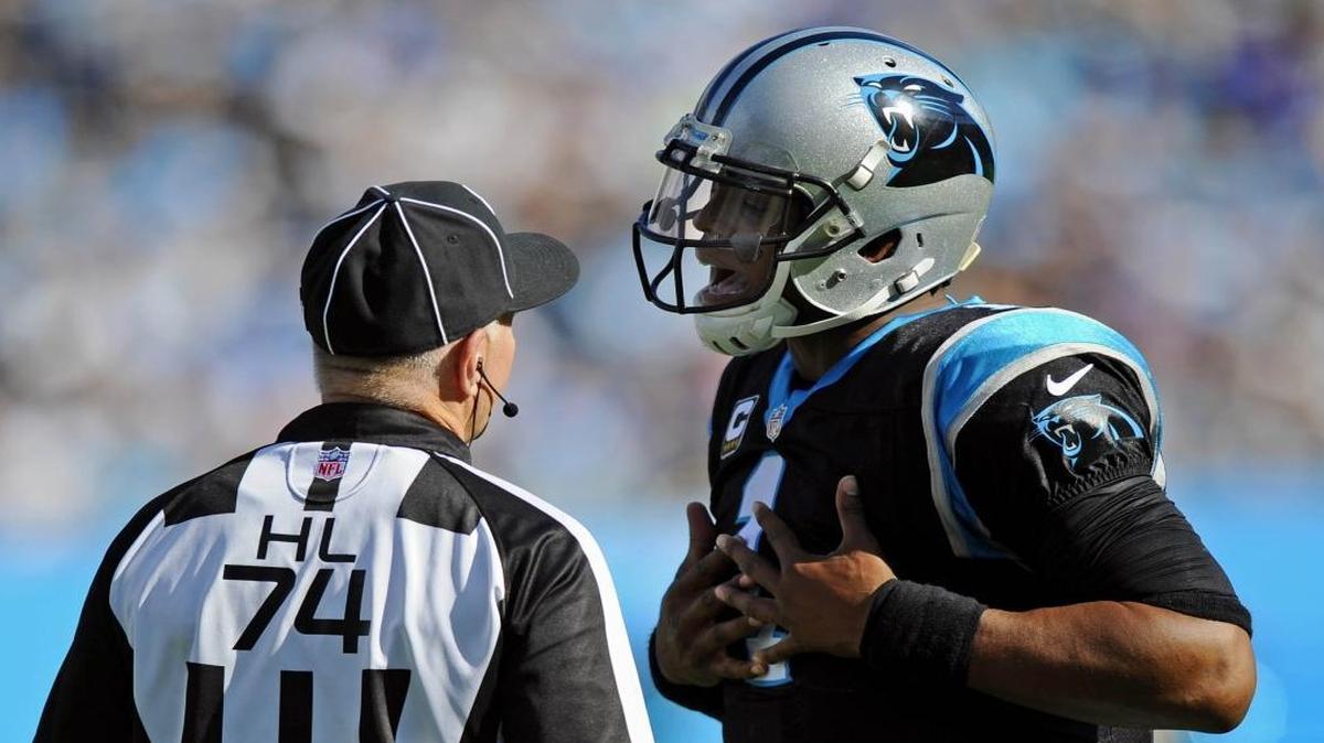 Carolina Panthers quarterback Cam Newton (1) questions head linesman Derick Bowers (74) about a call while playing against the Arizona Cardinals in the third quarter of their game at Bank of America Stadium on Sunday, October 30, 2016. The Panthers won, 30-20