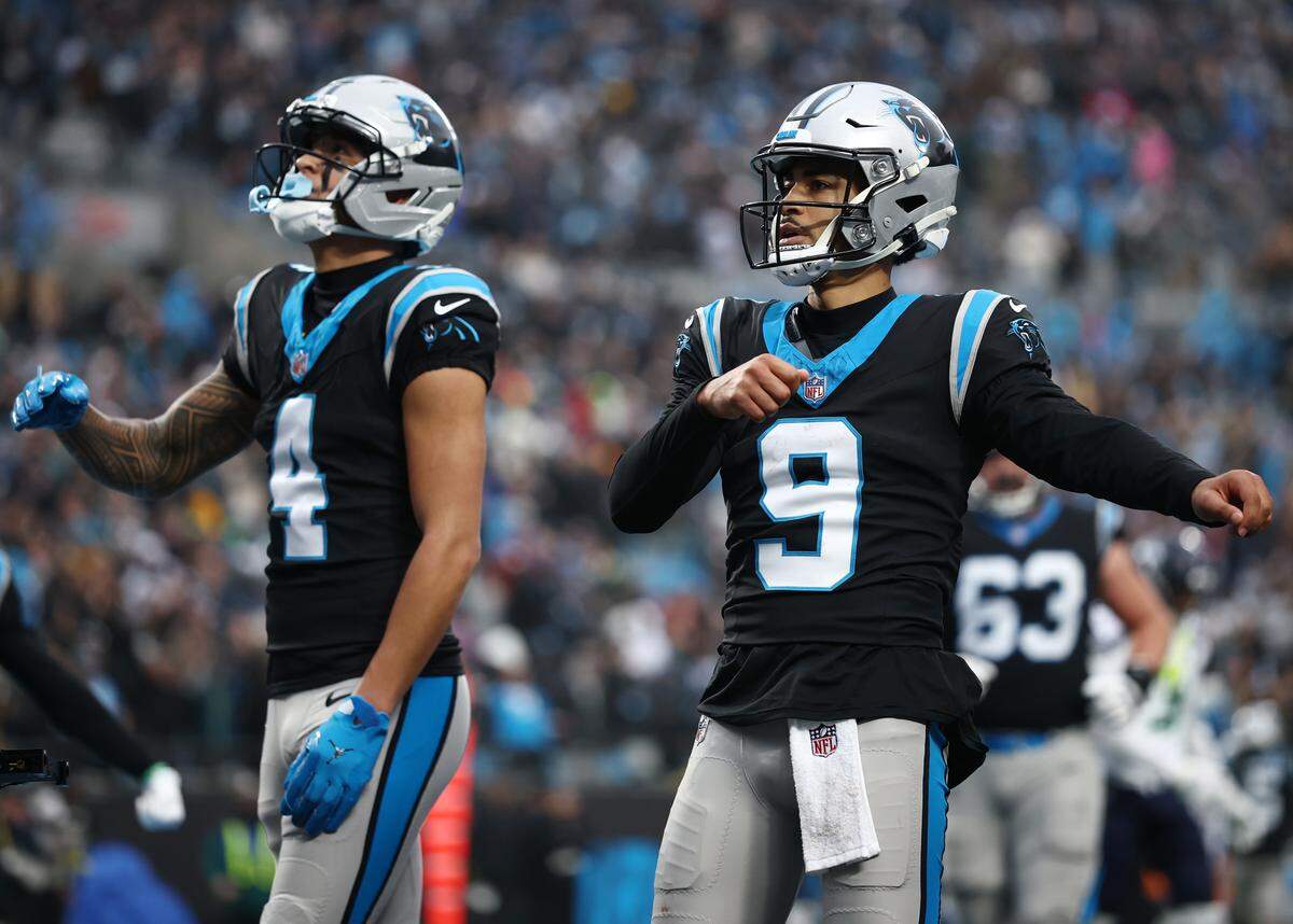 Bryce Young celebrates a touchdown with Carolina Panthers teammate Tetairoa McMillan during Sunday’s game in Charlotte.