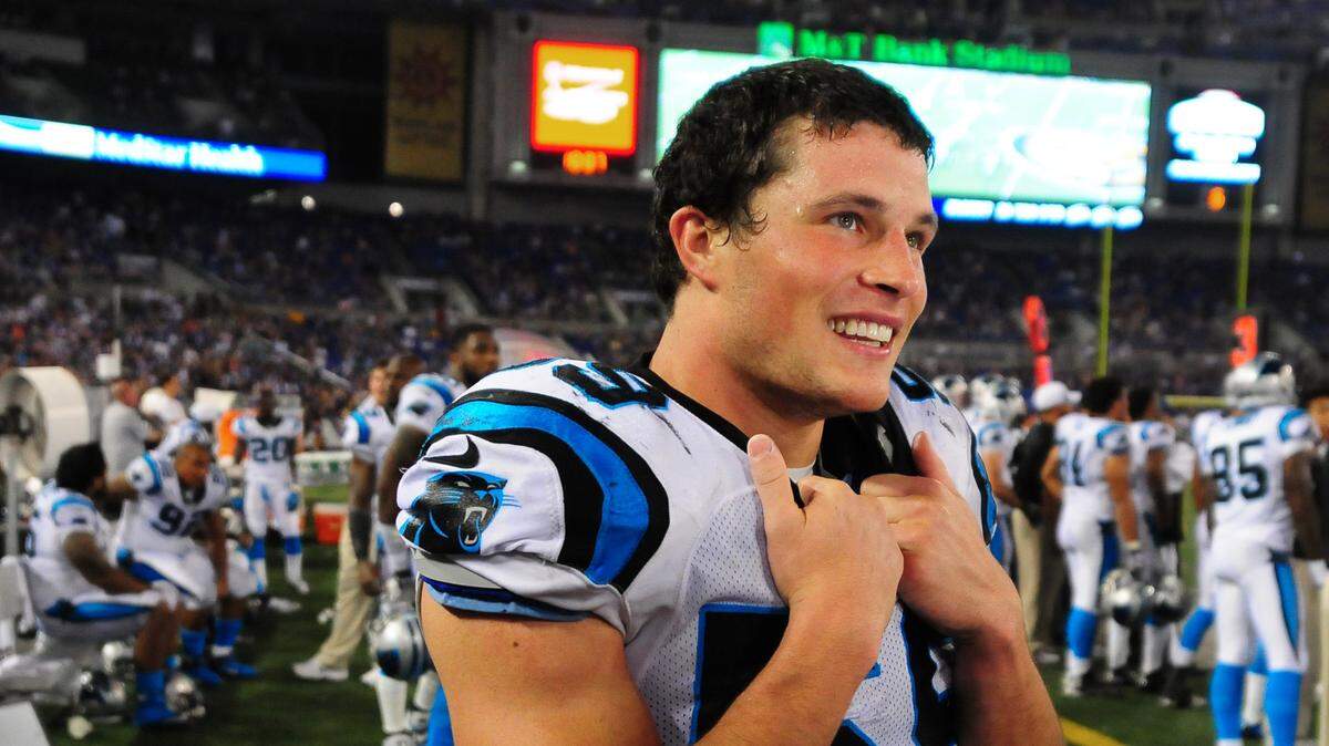 Carolina Panthers (59) linebacker Luke Kuechly smiles as he is interviewed by ESPN during the fourth quarter of a preseason game at Baltimore in 2013.