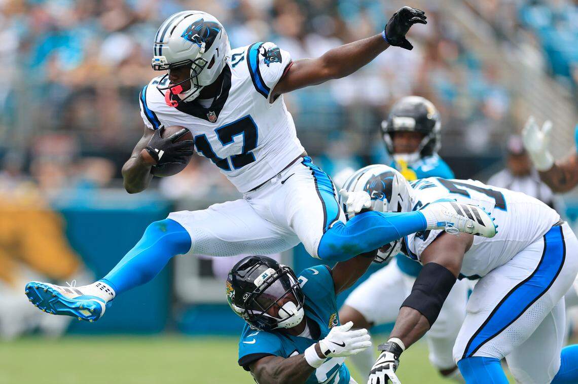 Carolina Panthers wide receiver Xavier Legette (17) leaps over Jacksonville Jaguars cornerback Jourdan Lewis (2) in Week 1.