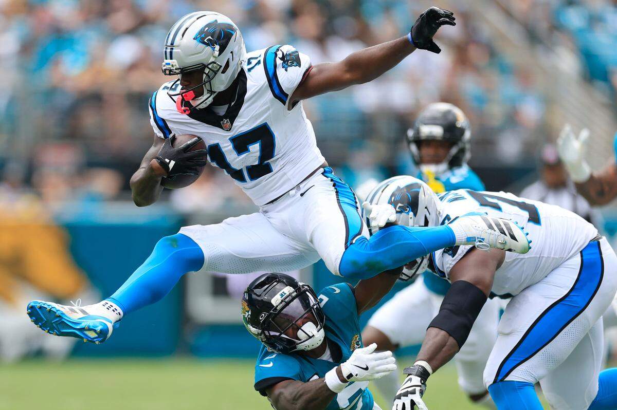 Carolina Panthers wide receiver Xavier Legette (17) leaps over Jacksonville Jaguars cornerback Jourdan Lewis (2) on Sept. 7.