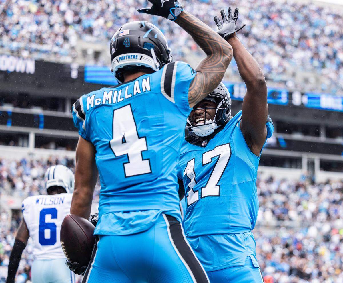 Carolina Panthers wide receiver Tetairoa McMillan, left, celebrates a touchdown with Carolina Panthers wide receiver Xavier Legette against the Dallas Cowboys on Oct. 12.