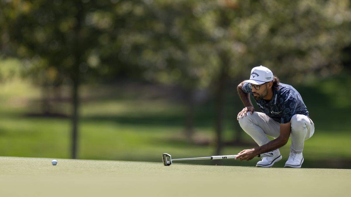 Akshay Bhatia lines up his putt on the 12th hole during the second round of the Truist Championship at Quail Hollow Club in Charlotte, N.C., on Friday, May 8, 2026. 
