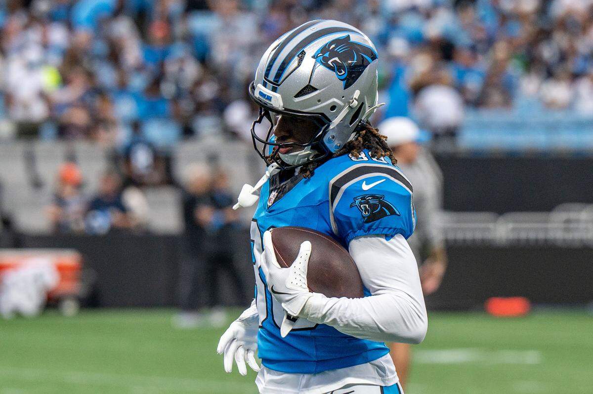 Carolina Panthers wide receiver Ja'seem Reed runs with a football during the Carolina Panthers' fan fest open practice at the Bank of America Stadium in Charlotte, NC, Saturday August 2, 2025.
