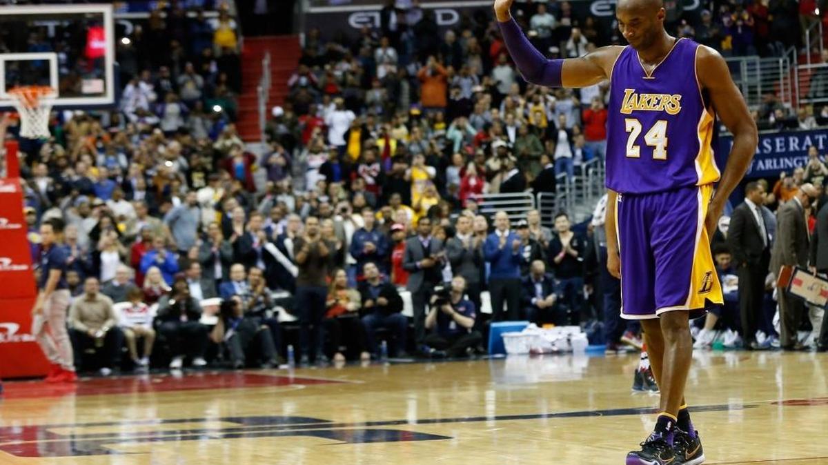 WASHINGTON, DC - DECEMBER 02: Kobe Bryant #24 of the Los Angeles Lakers waves to the crowd after his upcoming retirement was announced on the video board during the first half against the Washington Wizards at Verizon Center on December 2, 2015 in Washington, DC.