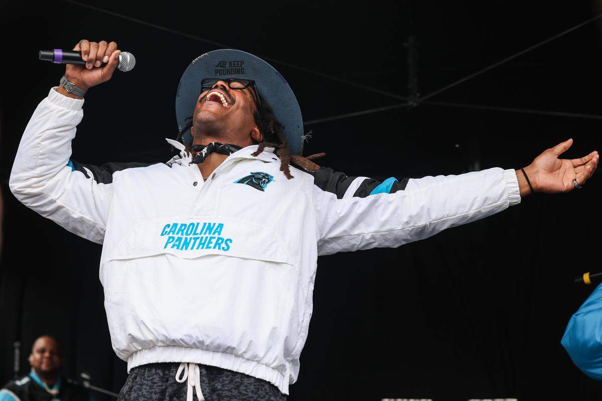 Former Panthers legend Cam Newton takes the stage for the airing of his podcast “4th&1” during the Roaring Riot tailgate before the Wild Card playoff game in Charlotte on Saturday, January 10, 2026.