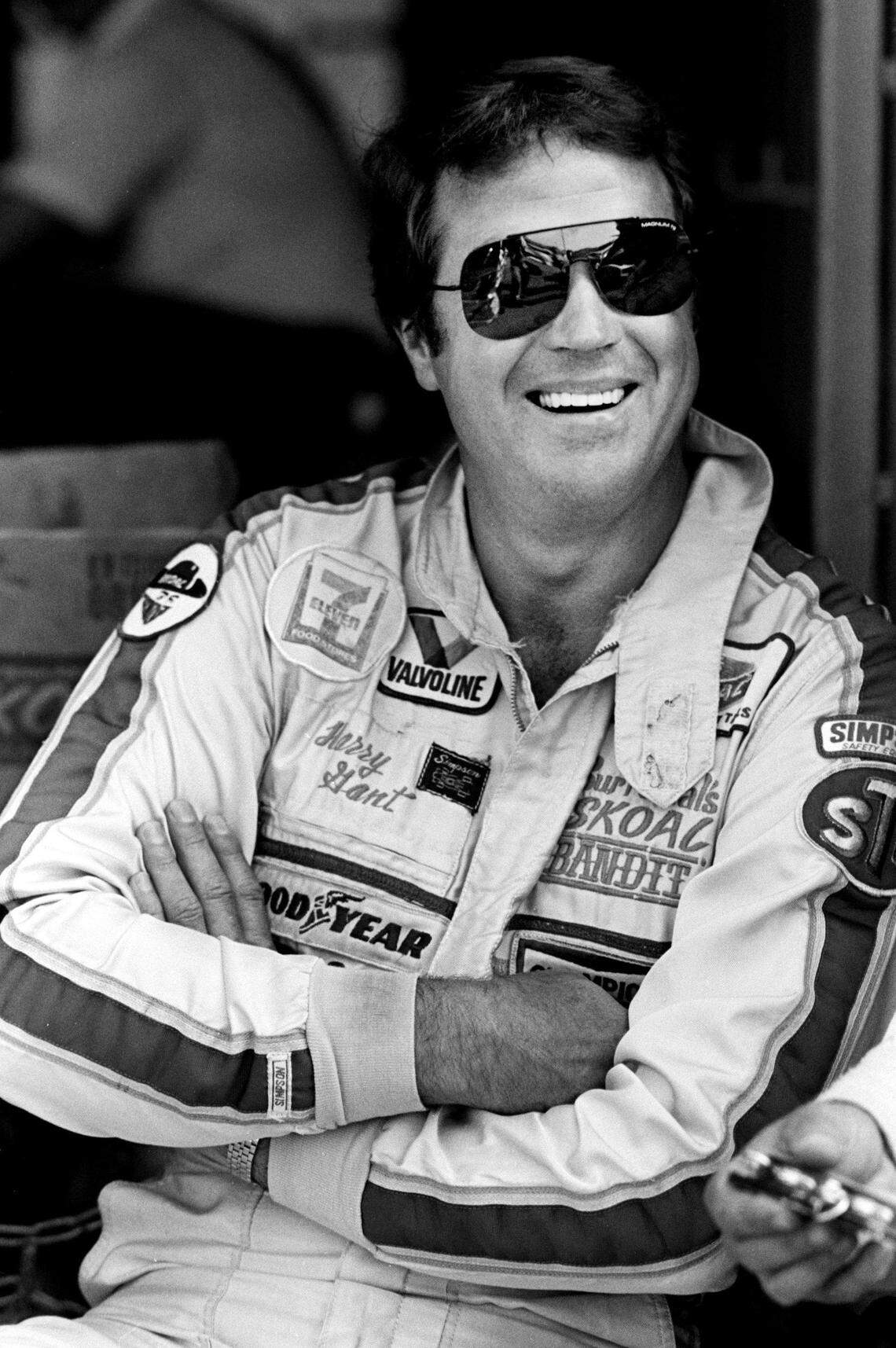 Driver Harry Gant takes a break during qualifying trials for the Nashville Pepsi 420 NASCAR Grand National race at Nashville International Raceway on July 13, 1984. 