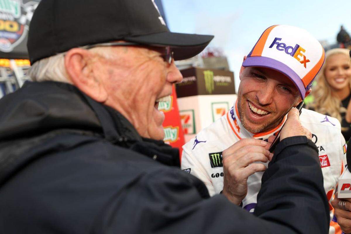 FORT WORTH, TX - MARCH 31: Team owner Joe Gibbs celebrates with Denny Hamlin, driver of the #11 FedEx Office Toyota, after winning the Monster Energy NASCAR Cup Series O'Reilly Auto Parts 500 at Texas Motor Speedway on March 31, 2019 in Fort Worth, Texas. (Photo by Chris Graythen/Getty Images)