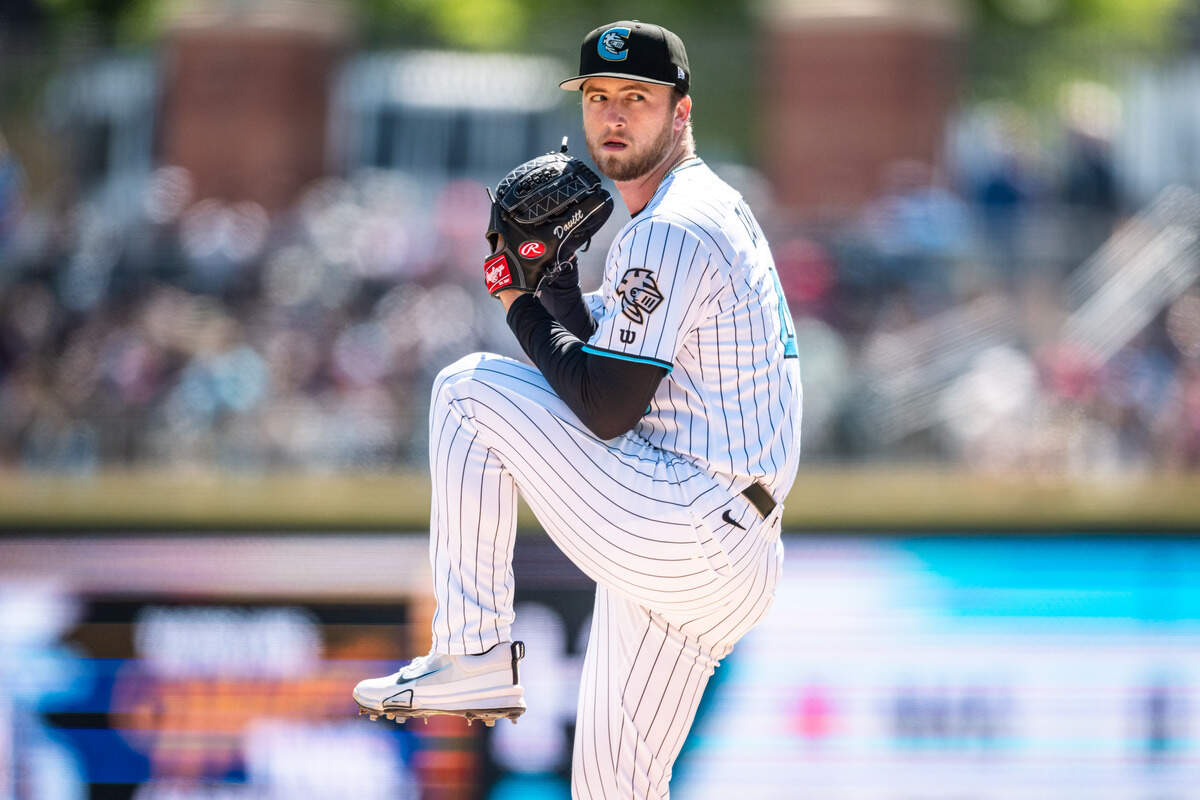 Duncan Davitt, right-handed pitcher for the Charlotte Knights, is also a stellar sportswriter. Newspapers, after all, are part of the family business.
