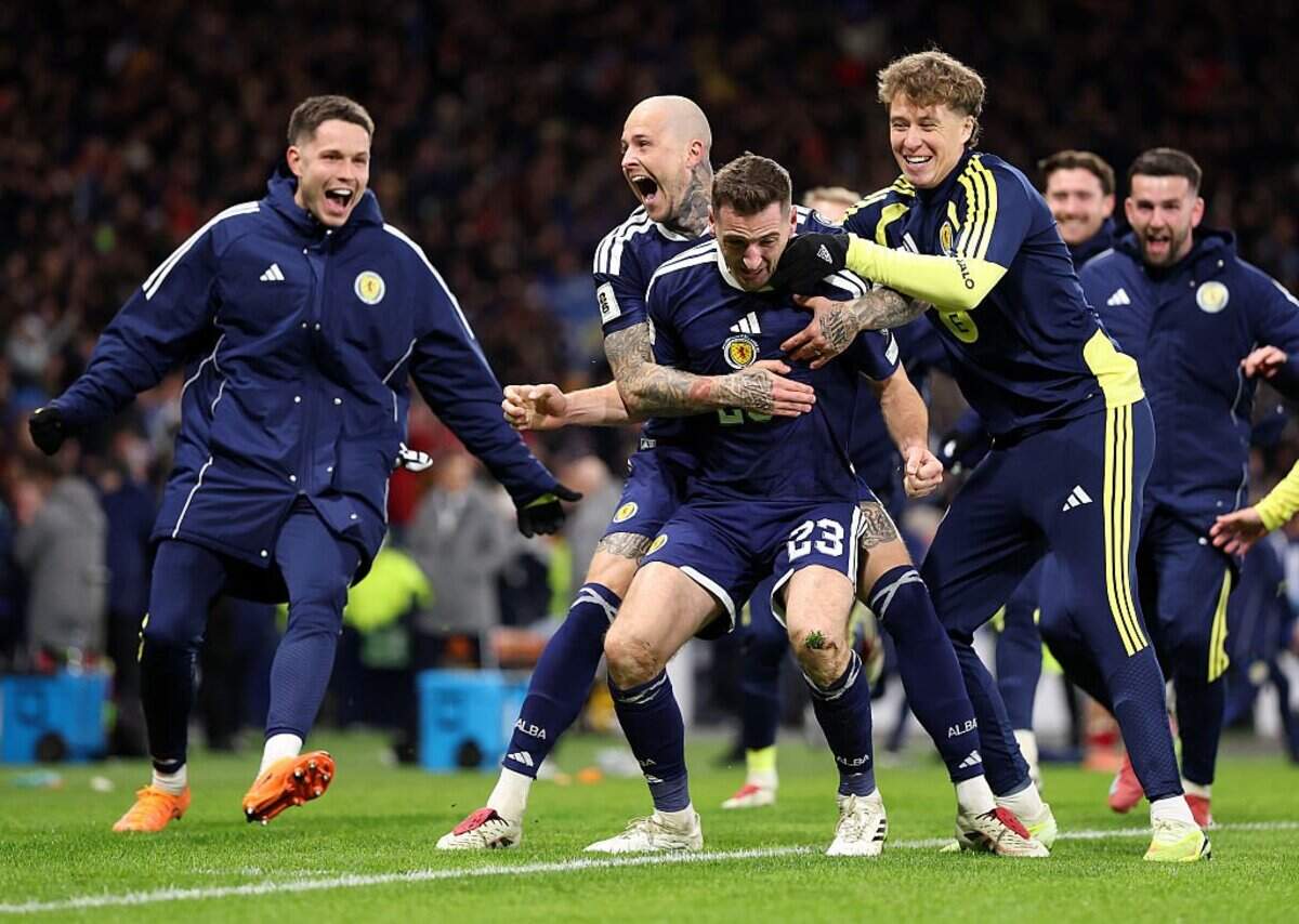 GLASGOW, SCOTLAND - NOVEMBER 18: Scotland player Kenny McLean celebrates with Lyndon Dykes and team mates after scoring the fourth Scotland goal during the FIFA World Cup 2026 qualifier match between Scotland and Denmark at Hampden Park on November 18, 2025 in Glasgow, Scotland. (Photo by Stu Forster/Getty Images)